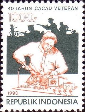 Colnect-937-692-Battle-and-disabled-man-using-soldering-iron.jpg