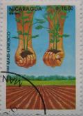 Colnect-1447-120-Farmland-Hands-with-Plants.jpg