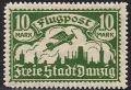 Colnect-3181-303-Airplane-flying-over-the-silhouette-of-the-skyline-of-Danzig.jpg