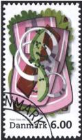 Colnect-1275-864-Sandwich-with-rolled-sausage-and-onions.jpg