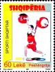 Colnect-5986-834-Weight-lifter-and-Olympic-rings.jpg