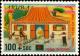 Colnect-3750-960-Family-playing-in-front-of-house.jpg