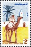 Colnect-4434-931-Dromedary-Camelus-dromedarius-with-Rider.jpg