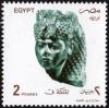 Colnect-4459-122-Woman-wearing-headdress.jpg