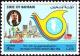 Colnect-862-415-Emblem-in-front-of-silhouette-of-Manama.jpg