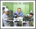Colnect-2233-164-As-Doctors-with-Chemical-Apparatus.jpg