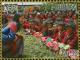 Colnect-4045-920-Queen-Jetsun-Pema-and-crowd-of-children.jpg
